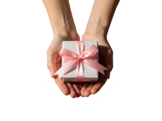 Hands holding a gift box with a pink bow isolated on transparent background