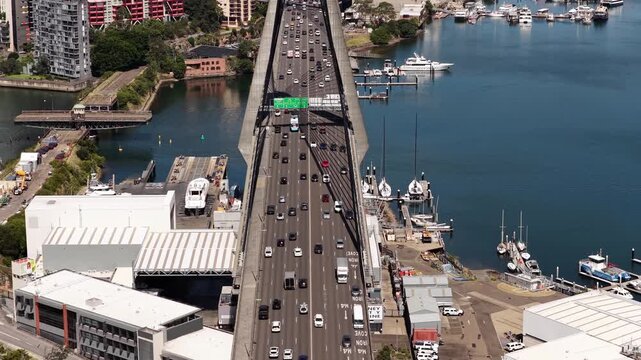 Multi-lane motorway across Anzac bridge in Sydney to city CBD aerial vertical panorama.