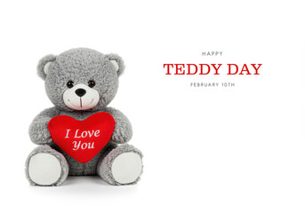 Gray teddy bear holding a red heart with I Love You text on white background plush toy stuffed animal