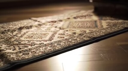 Detailed Traditional Carpet Design on a Polished Wooden Floor, Captured with a Slow-Motion Effect