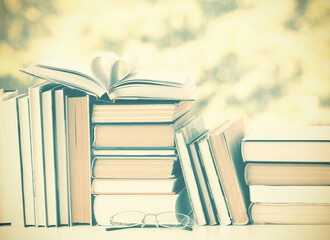 A simple composition of many hardback books. Going back to school. Education.