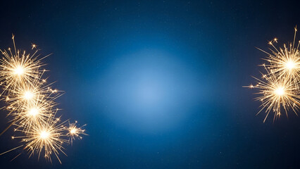 Golden sparklers create a festive, celebratory mood against a deep blue, starry background