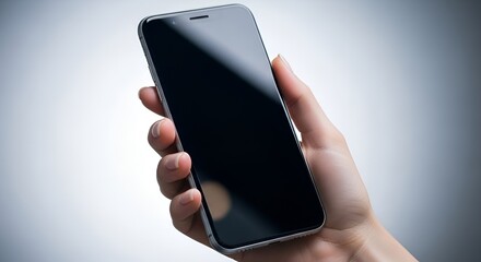A hand holding a smartphone with a blank screen