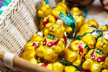 Decorative Glass Christmas Ornament of a Teddy Bear Reading a Book in an Armchair