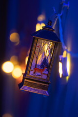 Christmas decorations, lanterns and glowing garlands with balls