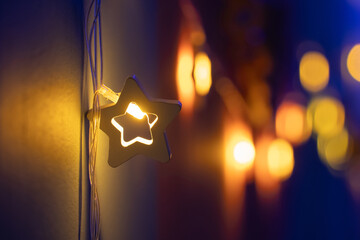 Christmas decorations, lanterns and glowing garlands with balls