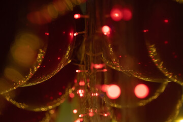 Christmas decorations, lanterns and glowing garlands with balls