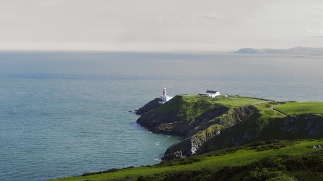 A Calm Sea and a Lighthouse in Ireland