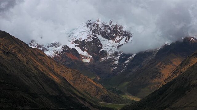 Mount Humantay Salkantay Peru aerial drone high altitude Peruvian Andes snow capped glacier peaks Laguna Humantay Lake landscape dry season cloudy sunny morning Anta province zoom in