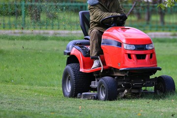 Obraz premium lawn mower in the park