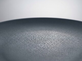 Close-Up of a Wet Gray Plate with Water Droplets