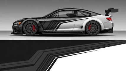 Obraz premium Sleek modern silver sports car with aggressive stance and aerodynamic design and high performance appeal.