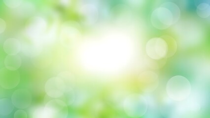 Soft green bokeh background with circular light orbs and a bright central glow