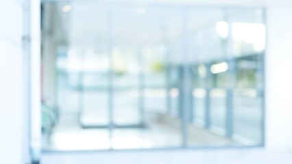 Abstract blurred view of a modern glass-walled lobby interior
