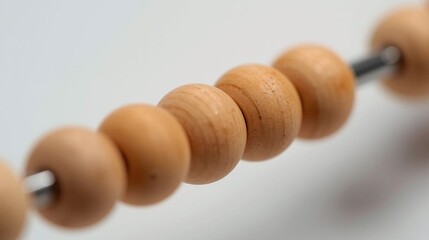 Close-up of wooden beads on a metal rod