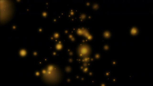 Falling gold magical festive Christmas golden circle orbs of light bokeh gently cascading over a plain black background with a magic holiday theme 4K