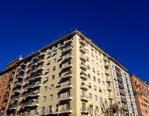 Multi-storey residential building under construction on a background of blue sky