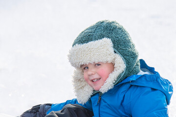 Little Boy Having Fun Playing in the Snow