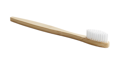 A simple bamboo toothbrush with white bristles on a black background isolated on transparent background