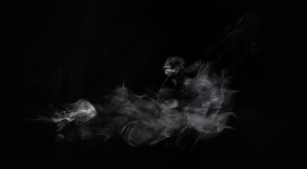 Wisps of white smoke isolated on a black background with space for text