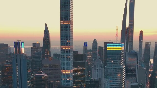 Sky view of New York City at sunset capturing tall buildings and lights