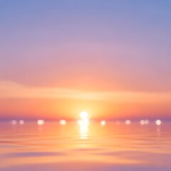 Sunset over the ocean with a beautiful orange glow.