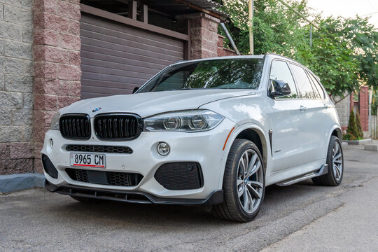 Almaty, Kazakhstan - July 21, 2025: A white BMW X5 xDrive 3.5 is parked in the parking lot