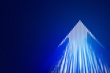 A blue background with vertical lines of white rectangles, arranged in the shape of an upward-pointing arrow, creates a sense of motion and depth.