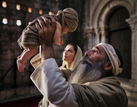 The Elder Simeon holds the Infant Jesus in his arms. Mary and Joseph stand nearby. Feast of the Presentation of the Lord.