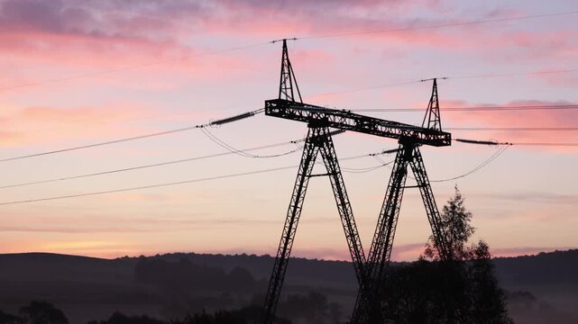 Pylon design, Line sunset, Electric landscape. At dusk, power lines connecting electric towers glowed, showcasing transmission lines.