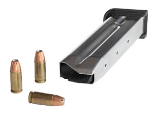 Three 9 mm cartridges unloaded from a steel pistol magazine