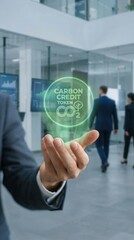 carbon dioxide sustainability monitoring concept. A person holding a digital carbon credit token in an office setting.