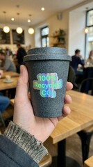 carbon dioxide sustainability monitoring concept. Reusable coffee cup in a cozy caf&eacute; setting promoting sustainability.