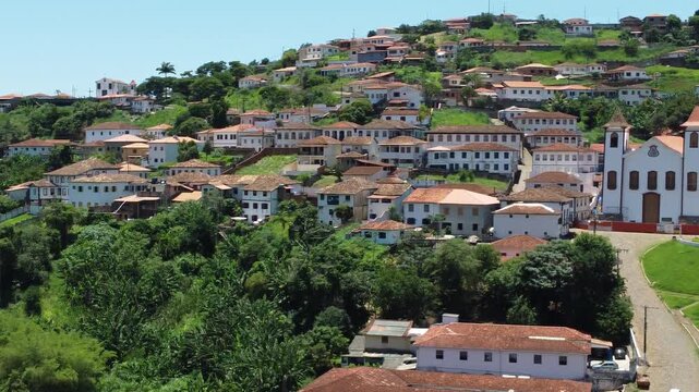 Drone video showcasing the historic houses of Serro, Minas Gerais, Brazil, highlighting preserved colonial architecture, traditional streets, and the cultural heritage of this historic Brazilian town.