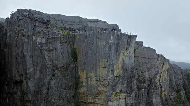 Vertical cliffs of Pulpit Rock Preikestolen Norway. Close aerial view highlights the sheer rock walls and rugged textures, emphasizing the scale of this famous Norwegian tourist landmark.