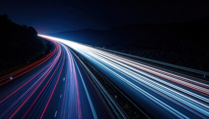 Long exposure shot of car lights on highway at night.