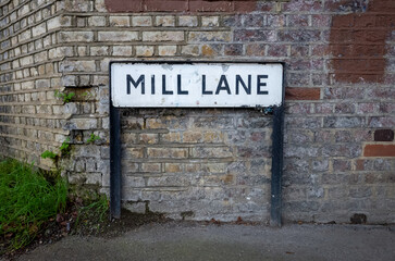 Fototapeta premium Street sign against textured brick wall