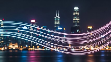City skyline at night with colorful light trails over water