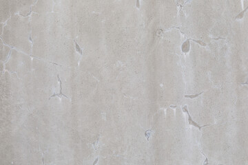High resolution full frame texture of a very light gray, fine grain, concrete surface.