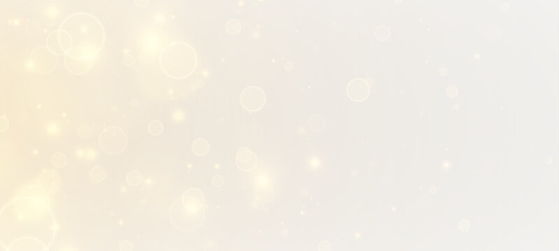 Golden glittering background. Shiny dust, bokeh effect. Magic falling golden lights and stars.