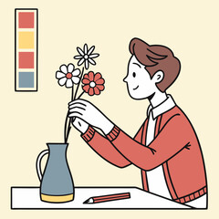 Person arranging flowers in a vase with a pencil