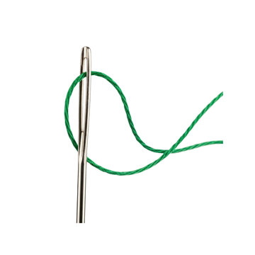 Needle eye with green thread