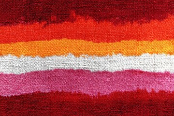 Lesbian Pride Flag: A close-up view of the lesbian pride flag, an emblem of identity and solidarity, its vibrant stripes representing the diverse experiences and shared heritage of the community.