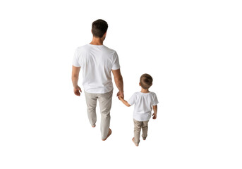 top view of caucasian father and young son in matching casual attire walking away, holding hands firmly, isolated on a transparent studio background. concept of familial bond and security