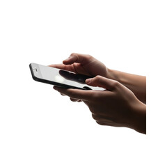 Hand holding and using smart phone