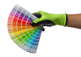 a hand in a textured black rubber and neon lime green work glove firmly grips an open architectural color swatch palette showing a continuous rainbow gradient spectrum. concept of design precision