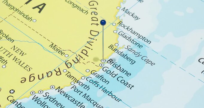 A zoom out of a blue pin into brisbane city of australia political map