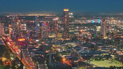 City lights of New York shine bright during the night sky