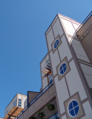 Top of residential building on blue sky background
