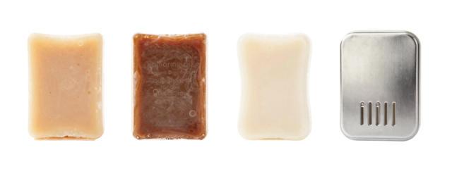 Four rectangular bars of soap, side by side: beige, brown, white, and silver with ventilation holes.
